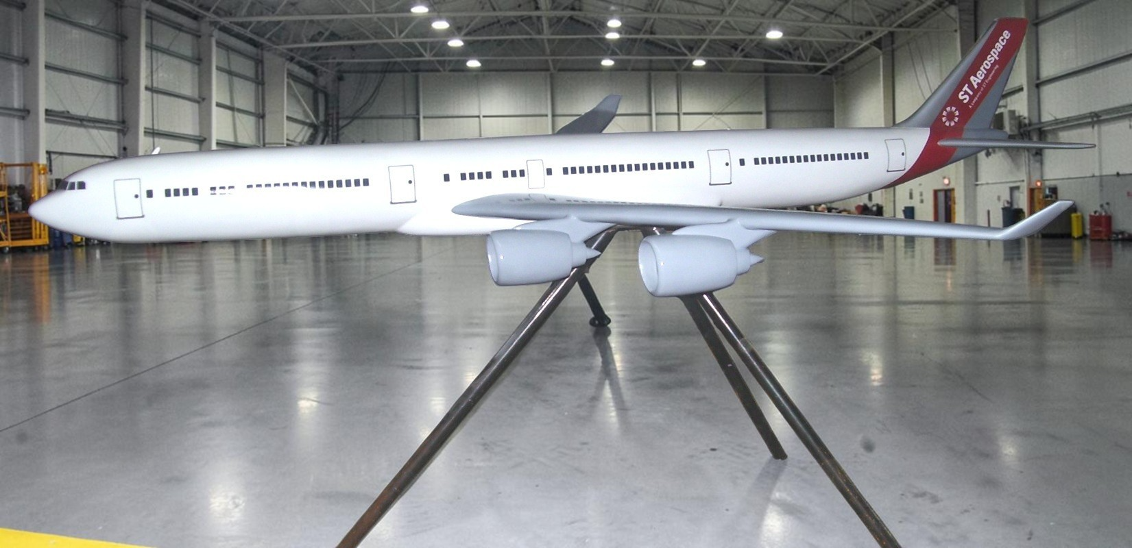ST Aerospace airliner model displayed in a modern hangar
