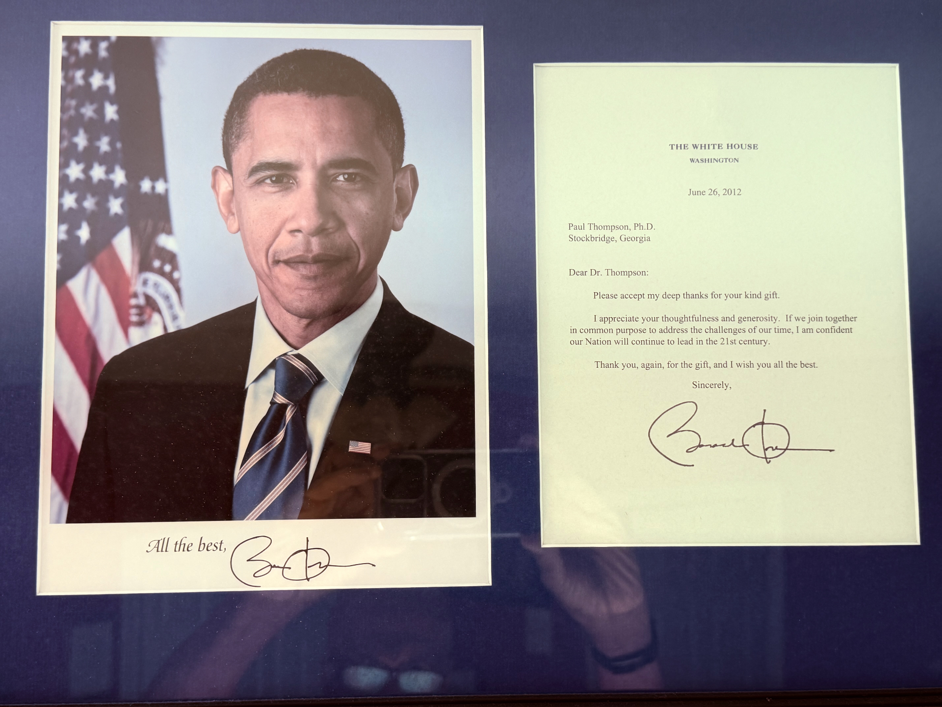 Framed display with a photograph of President Barack Obama and a White House letter of thanks addressed to Paul Thompson